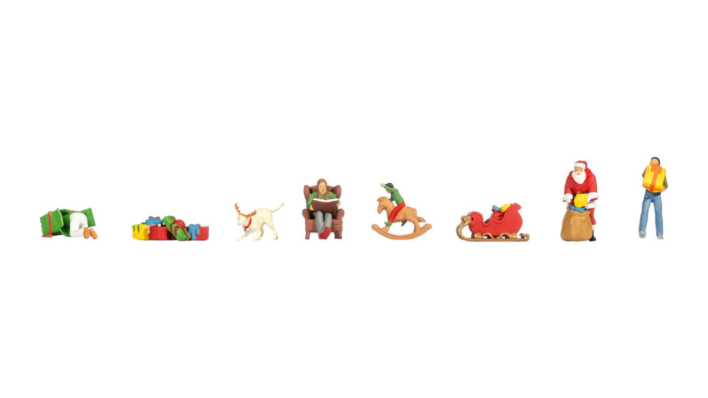 NOCH NO16291 Themed Figures Set ‘Christmas’ Contents: 2 men with gifts 1 Father Christmas 1 woman in an armch…